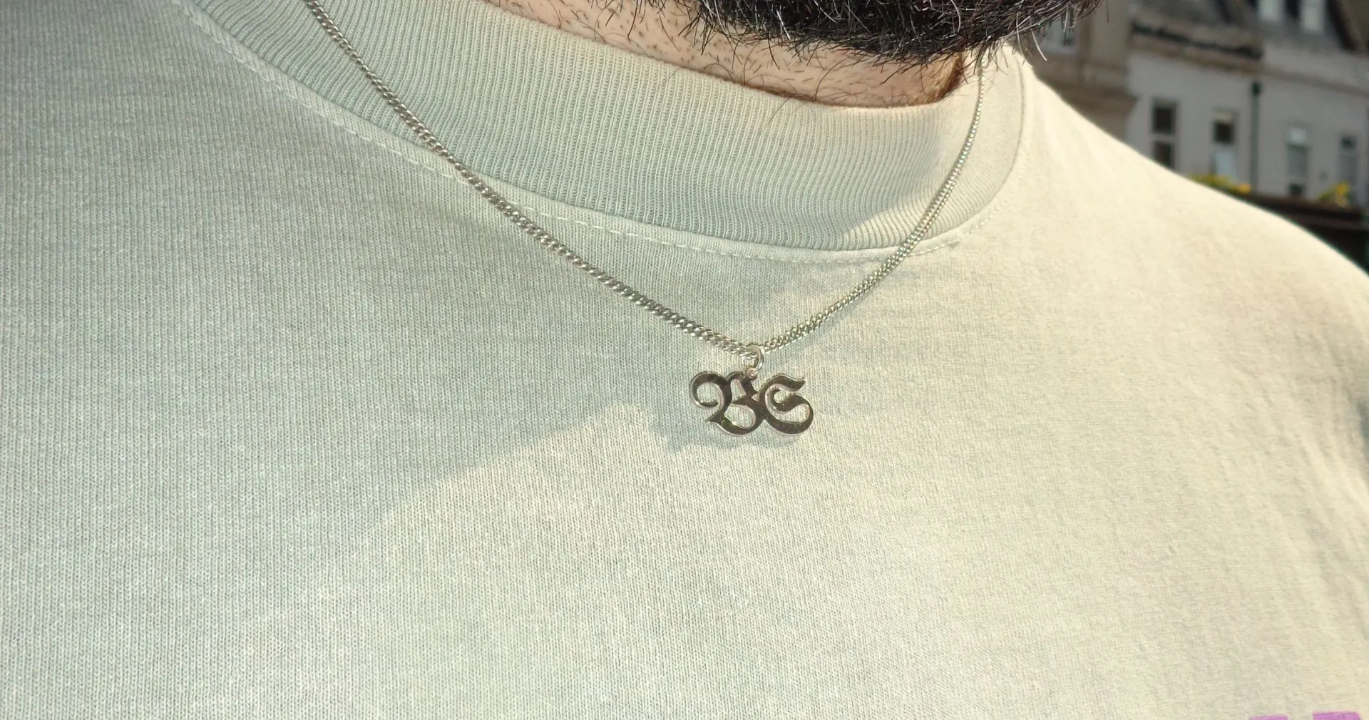 A silver BS monogram pendant